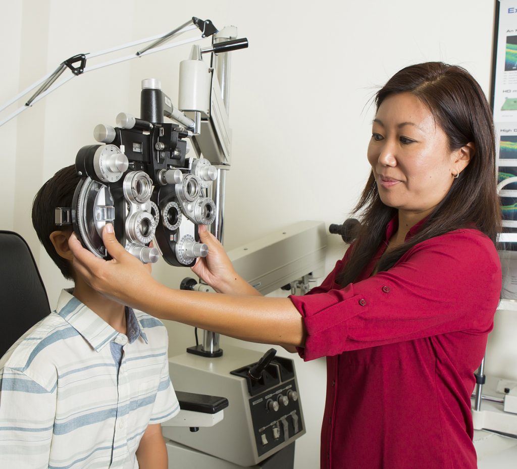 Photo of Dr. Kari Chang-Moses during an exam